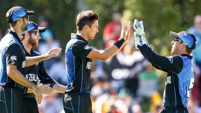 Trent Boult (centre) of New Zealand celebrates