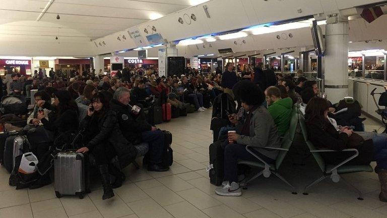 Passengers waiting at Gatwick airport