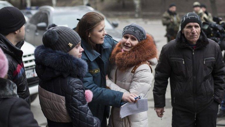 Family members stand outside the Zasyadko mine, 4 March