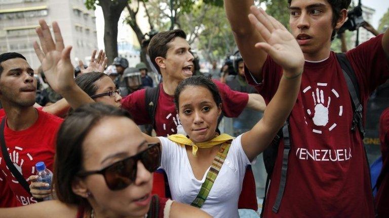 Opposition students march against Venezuelan President Nicolas Maduro"s government in Caracas 12 February 2015