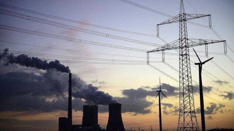 Steam rises from cooling towers at the coal-fired Kraftwerk Mehrum power plant at Haemelerwald