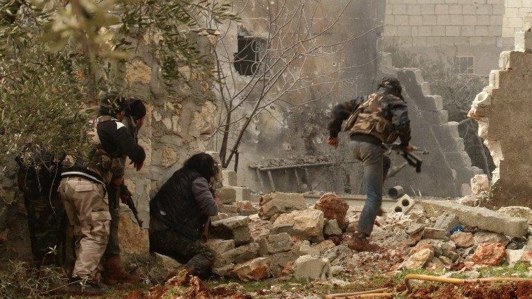 Rebel fighters in a village north of Aleppo in Syria