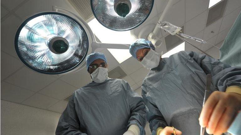 Surgeons in an operating theatre