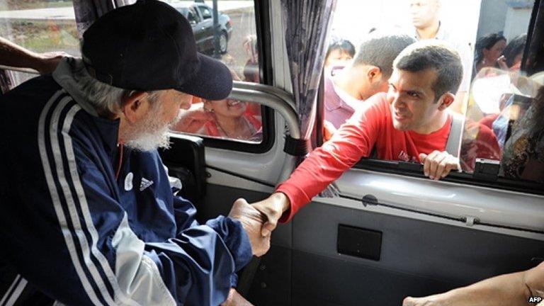 Official handout picture of Fidel Castro greeting a member of the Venezuelan delegation II flight Solidarity Bolivar-Marti who are in Cuba taking part in social and political activities, in Havana on March 30, 2015.