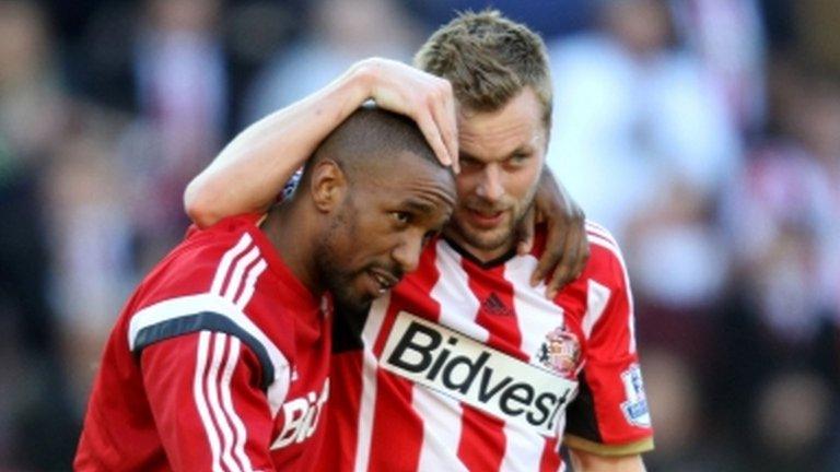 Jermain Defoe and Seb Larsson celebrate Sunderland's win over Newcastle