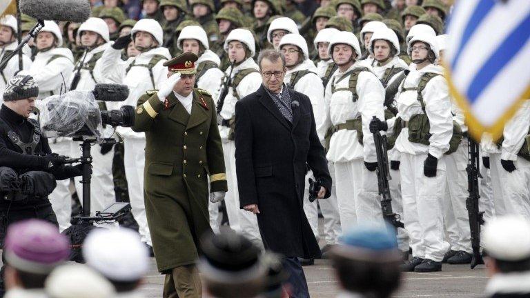 Estonian President Toomas Ilves inspects troops on independence day in Narva on the Russian border - 24 February