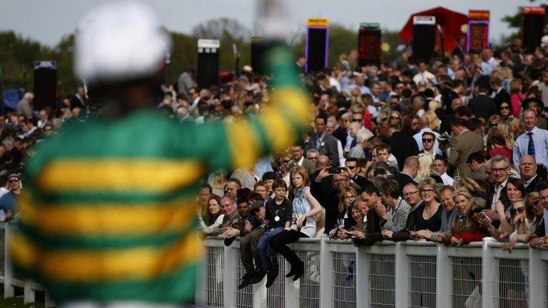 Jockey AP McCoy waves farewell at Sandown