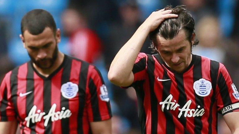 Steven Caulker and Joey Barton look dejected following QPR's relegation