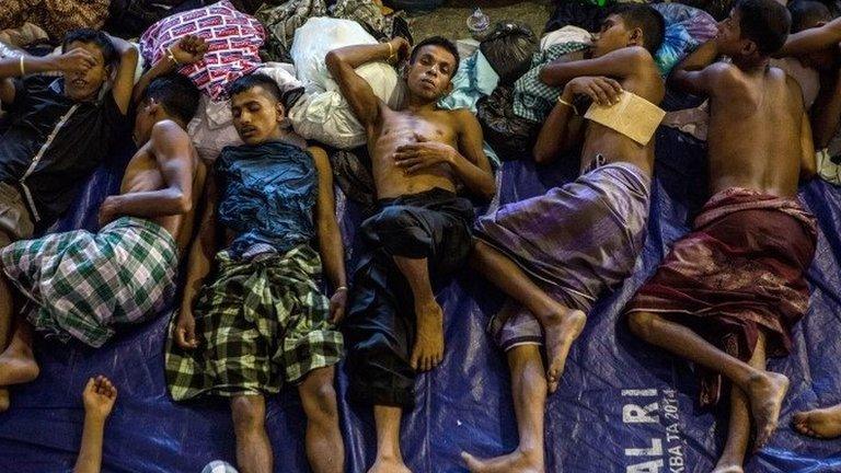 Rohingya and Bangladesh migrants rest inside a shelter on 13 May 2015 in Lhoksukon, Aceh province, Indonesia.