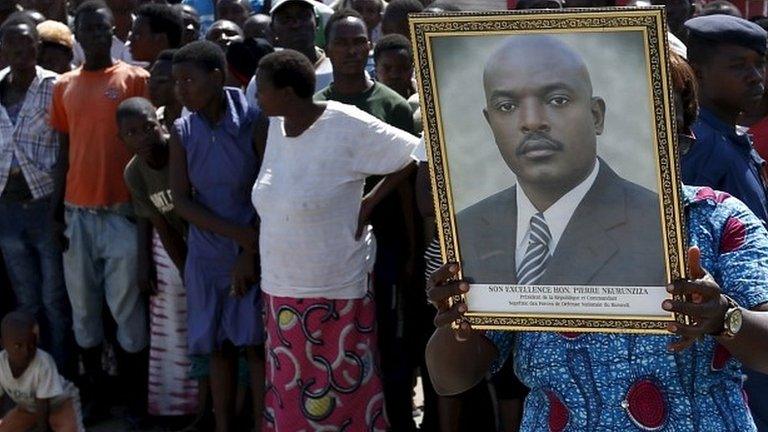 Supporter holds picture of Burundi President Pierre Nkurunziza while waiting for him to return to Bujumbura, 15 May 2015