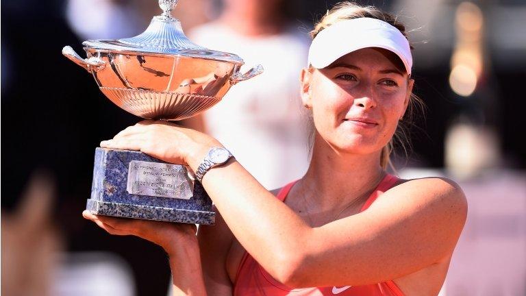 Maria Sharapova poses with the trophy