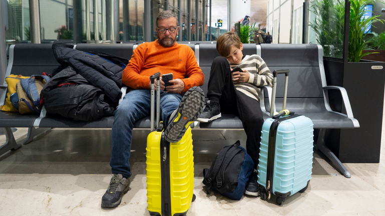 Father and son at airport