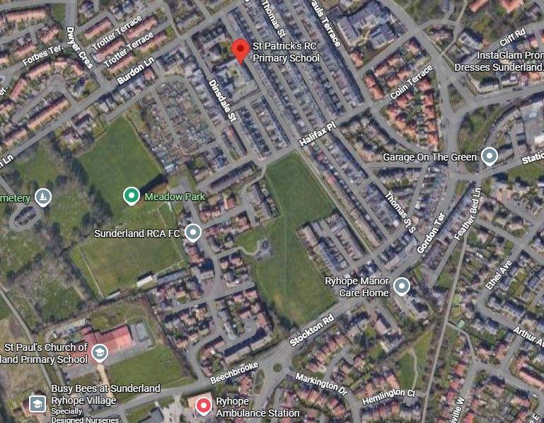A screenshot of Google Maps showing an aerial view of the area around St Patrick's Primary school. The area is largely residential with a large field in the middle of the screen. This is the proposed site of the new school. A red pin to the north of the fields highlights where St Patrick's is located.