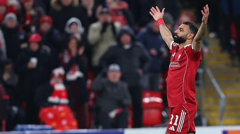 Mohamed Salah celebrates in front of the Anfield crowd