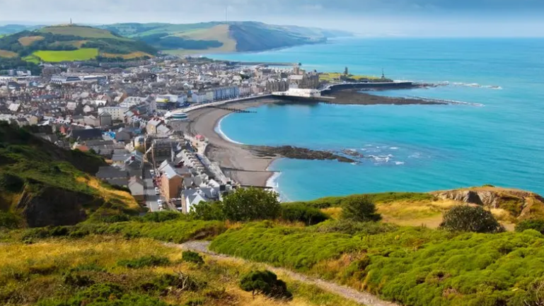 A view over the beach and buildings of Aberystwyth