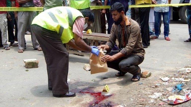 Bangladesh forensics police investigate the site where blogger Ananta Bijoy Das was hacked to death in Sylhet on 12 May 2015