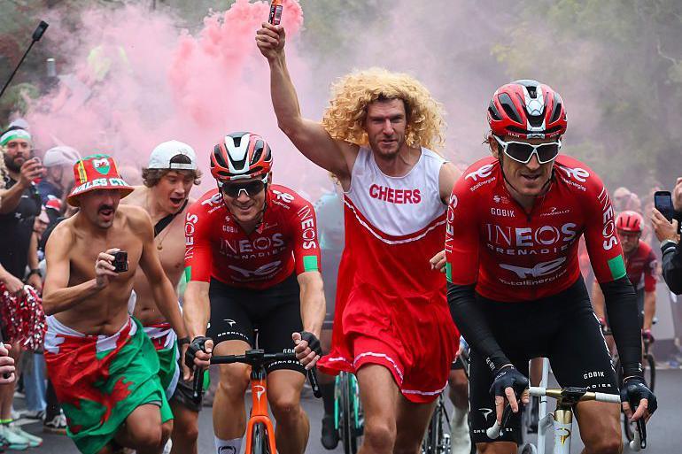 Geraint Thomas and Ben Swift of Ineos Grenadiers is escorted by Matt Rowe and others in fancy dress as he rides up Caerphilly Mountain on Stage 6 of the tour of Great Britain from Newport – Cardiff