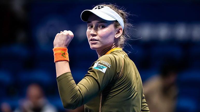 Elena Rybakina clenches her left fist in celebration