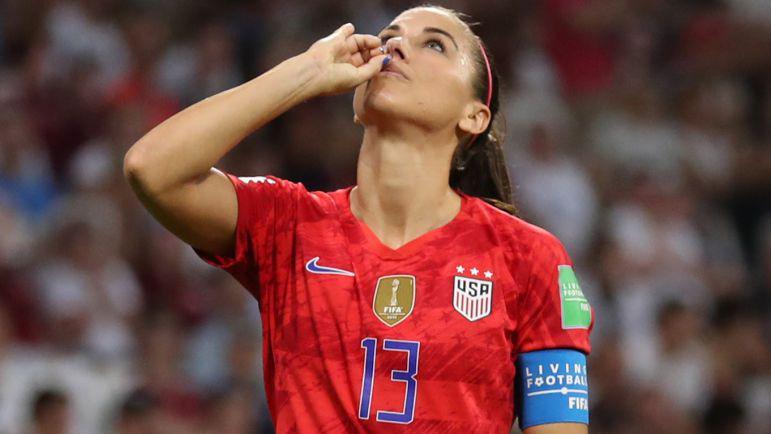 Alex Morgan celebrating against England by pretending to drink tea