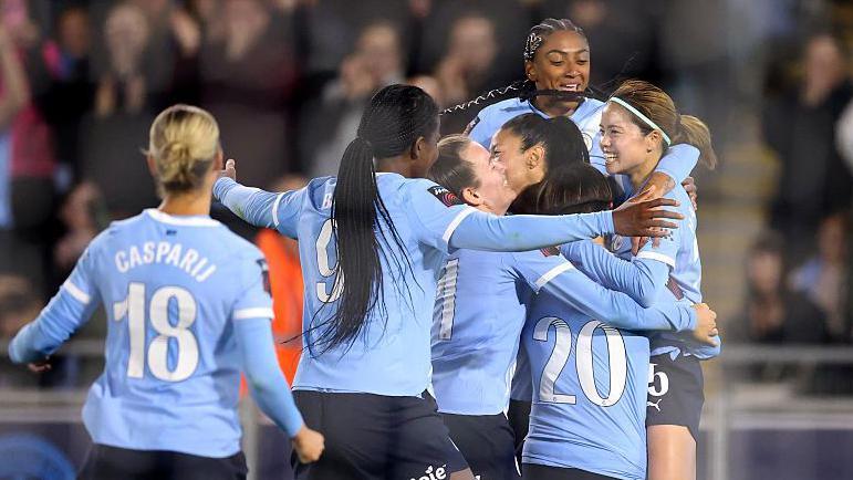 Manchester City celebrate with Yui Hasegawa