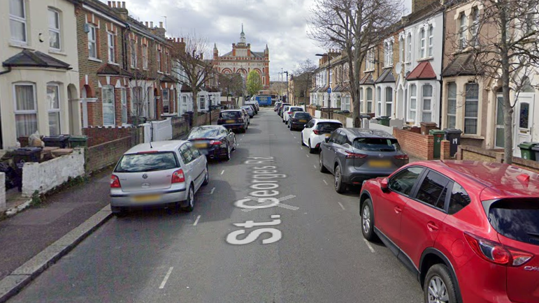 A Google street view image of part of St George's Road, with terraced houses and cars parked along both sides of the road. 