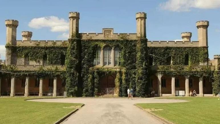 The outside of Lincoln Crown Court, covered in greenery 