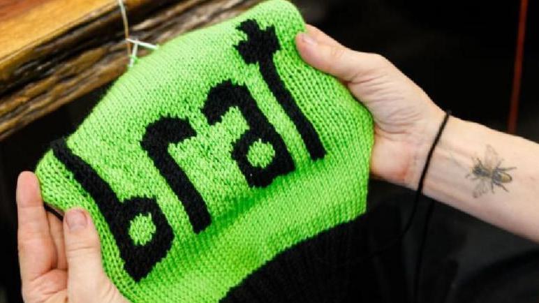 A picture of a hat named Brat that was knitted in support of Kamala Harris, by Annette Corsino, owner of the Knitting Tree LA