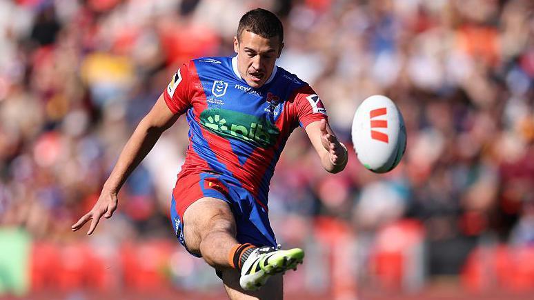 Jake Arthur kicks the ball while playing for Manly Sea Eagles
