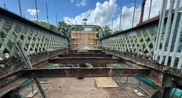 The main decking on the bridge has been removed to show the ironwork underneath.