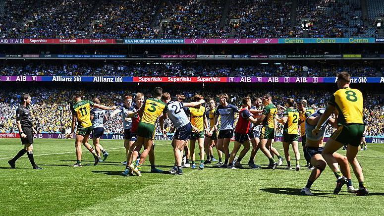 Dublin and Donegal players clash at the end of normal time 