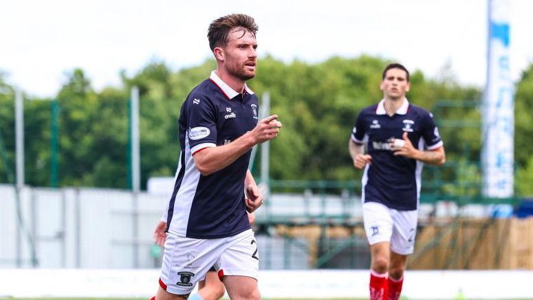 Ryan Strain celebrates opening the scoring for Falkirk