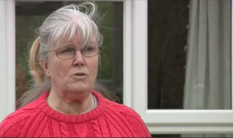 Jean Addison with long, fair hair wearing a red jumper