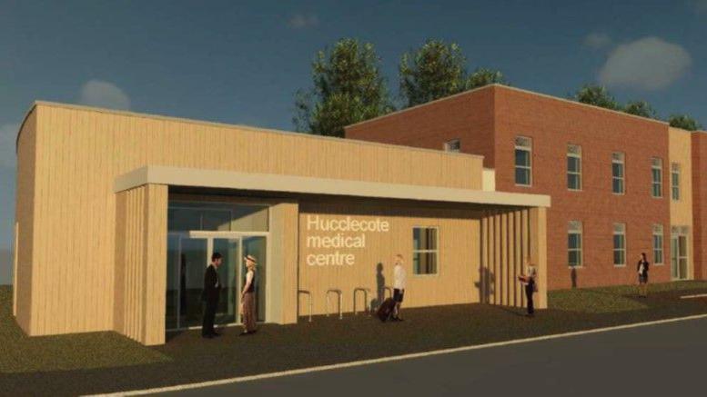An artist's impression of the new surgery. It shows a smaller, single-storey building with a large entrance and the words 'Hucclecote Medical Centre' on the front, next to several two-storey buildings.