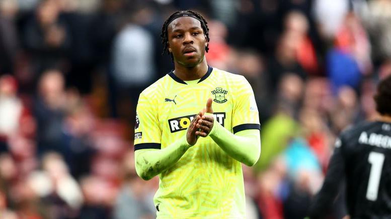 Armel Bella-Kotchap applauds Southampton fans after a game.