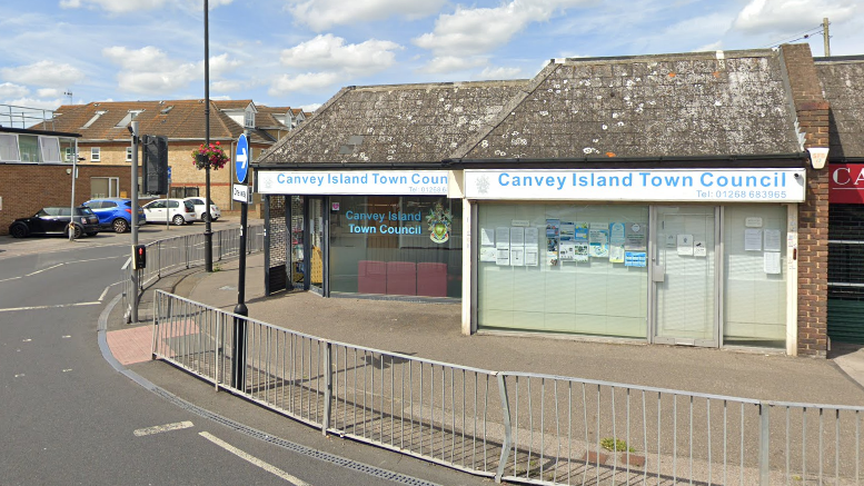 The Canvey Island Town Council offices. They are based in a single-storey building on the side of a road. The building has "Canvey Island Town Council" signs and a crest in the window.