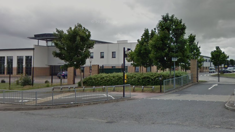 The exterior of St Joseph's Catholic College, Swindon. It is a large, rectangular building.