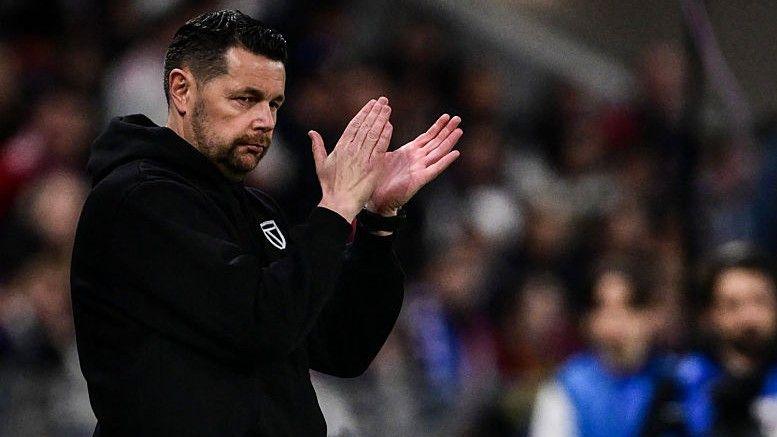 Pierre Sage clapping on the touchline
