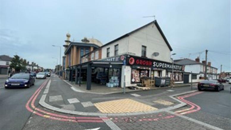 The front of Grosik Supermarket with the unauthorised the extension in front.