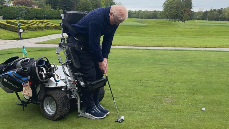 Alistair Bonham in action, using a Paragolfer - a device which allows users with lower limb disabilities to adopt a standing position in order to freely swing a golf club - at Lytham Green Drive Golf Club