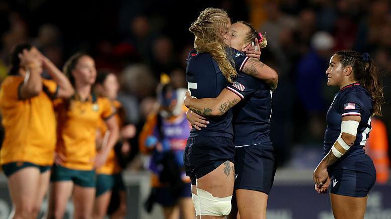 McKenzie Hawkins and Erica Jarrell-Searcy of the USA embrace at full-time