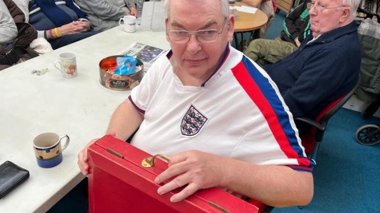 David Nicholls with a replica budget box