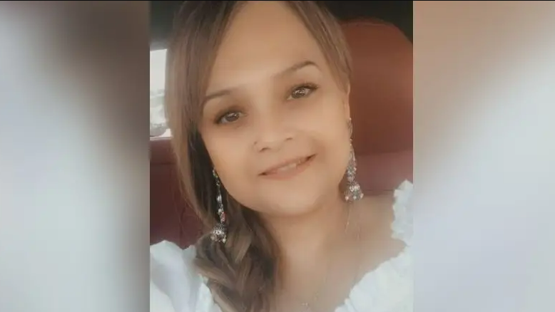 A selfie of Tarnjeet Riaz wearing a white top and a plait in her hair. 