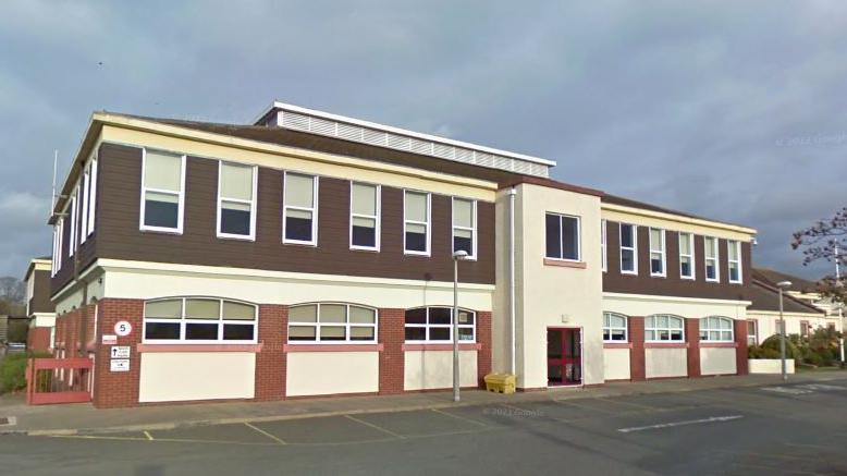 A corner view of the two storey block of a secondary school.