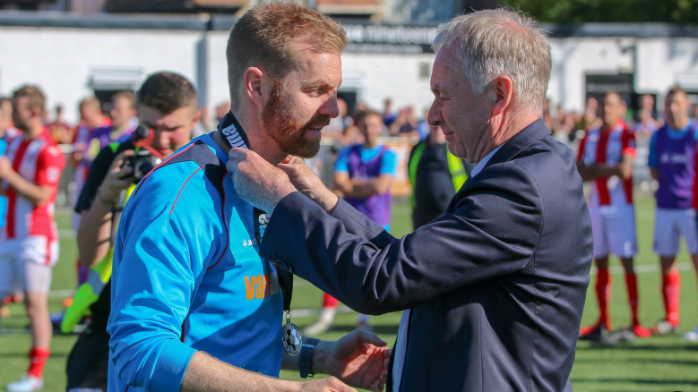 Harrogate Town manager Simon Weaver (left) is congratulated bu his dad and club chairman Irving Weaver after winning promotion in 2018.