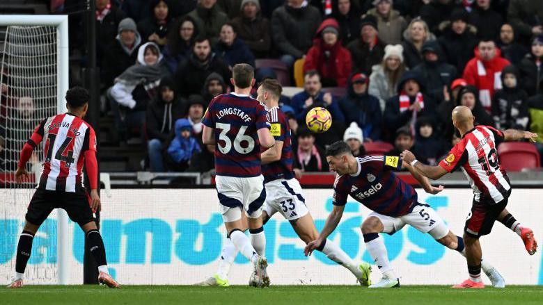 Bryan Mbeumo (right) scores for Brentford