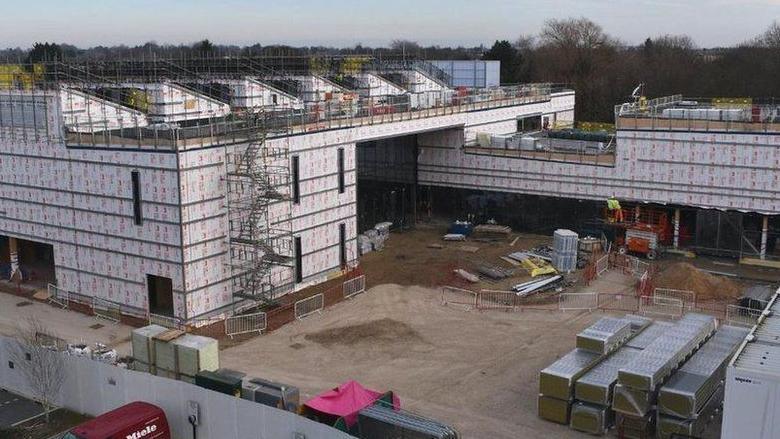 Anglia Ruskin University Peterborough's new lab under construction,  showing an incomplete building covered in scaffolding