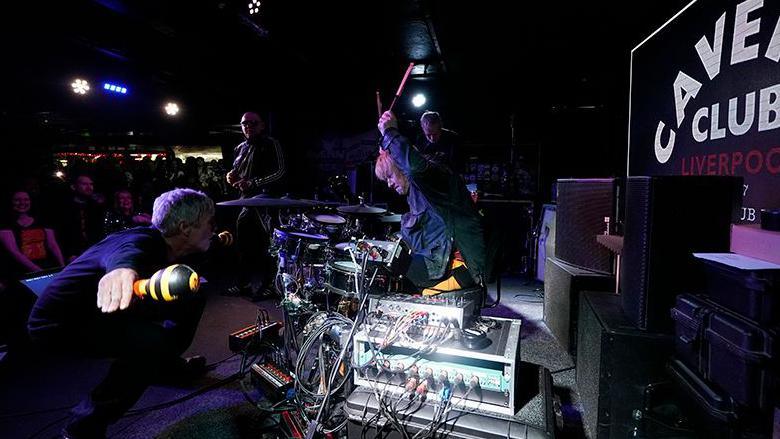 Zak Starkey, son of Sir Ringo Star, on drums performing with fellow band members (left to right) Bez, Shaun Ryder and Andy Bell of the Mantra of the Cosmos at The Cavern Club, Liverpool.