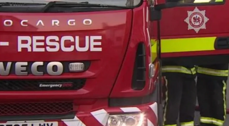 A red fire engine faces the front, with the Devon and Somerset Fire and Rescue branding visible on the door. 