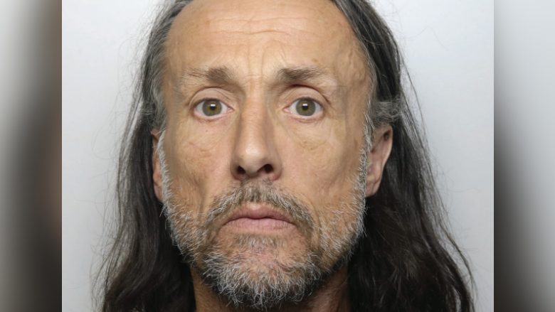 Mugshot of Richard Jones who has long, shoulder-length grey hair and a grey beard and moustache and is looking straight at camera with a neutral expression.