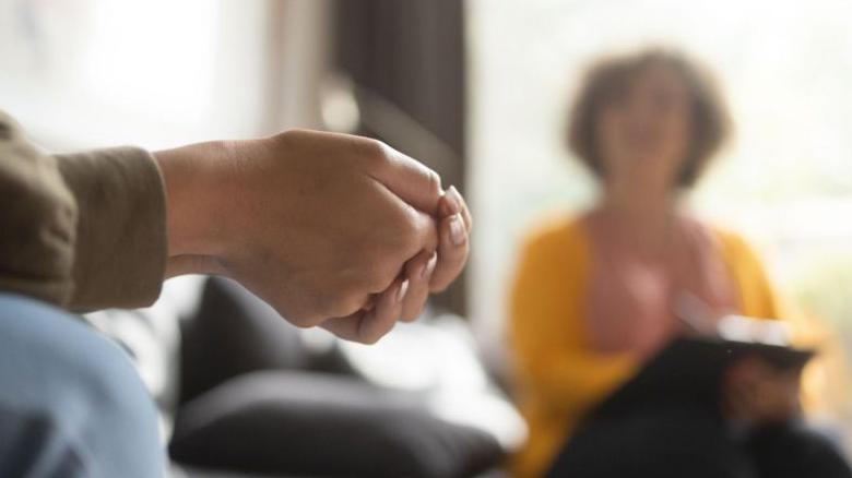 Hands at counselling session